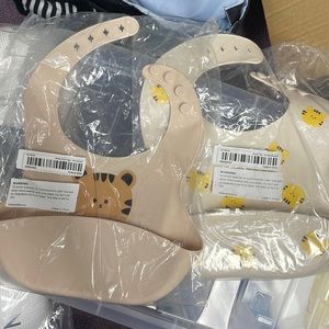 new bibs. silicone. supet soft bibs. baby food bibs. 9 for one. 15 for two.